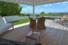 Shaded terrace with wicker chairs and ocean view beside jacuzzi at Villa Plumbago, st barts villa rental