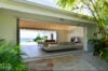 Open-plan living area with sea views and tropical garden setting at a luxury villa rental in St Barts
