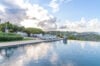 Sunset view over infinity pool and hillside landscape, luxury villa rental in St Barts