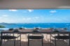 Elegant ocean-view dining terrace at st barts villa rentals with panoramic Caribbean horizon and sea breeze ambiance.