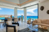 Bright living and dining area with ocean panorama inside luxury villa rental in St Barthélemy.