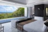 Sea-view bedroom with floor-to-ceiling windows and infinity pool at luxury villa rental in St Barthélemy