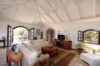 Bright living room with vaulted ceiling and open arches at Villa Plumbago, st barts villa rental