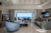 Spacious living room with ocean view, contemporary décor, and open terrace in a St Barts villa rental