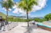 Terrace with giant chessboard, jacuzzi, and sea view at luxury villa rental in St Barths