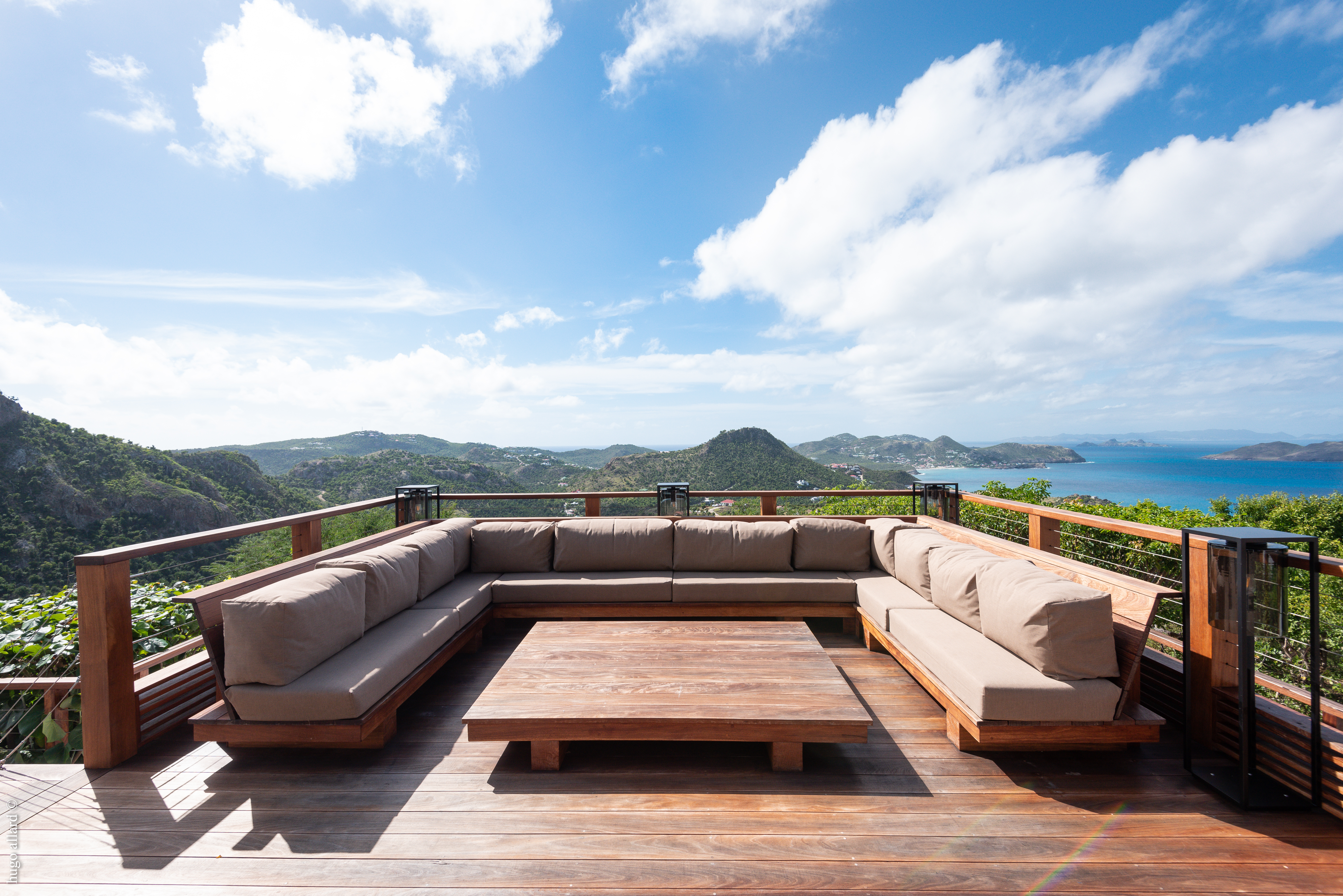 Outdoor lounge terrace at luxury st barts villa with panoramic island and ocean views.