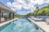 Luxury infinity pool with sun loungers and tropical views at a St Barts villa rental