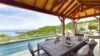 Covered dining terrace overlooking infinity pool and ocean at private villa rentals st barths.