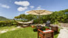 Garden lounge with hammocks and parasol at Villa Plumbago, Colombier, St Barthelemy vacation rentals.