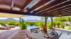 Outdoor dining terrace with pool and mountain view at Villa Plumbago, Colombier, vacation rentals St Barts.
