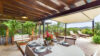 Covered outdoor dining terrace surrounded by tropical greenery at Villa Plumbago, Colombier, private villa rentals St Barts